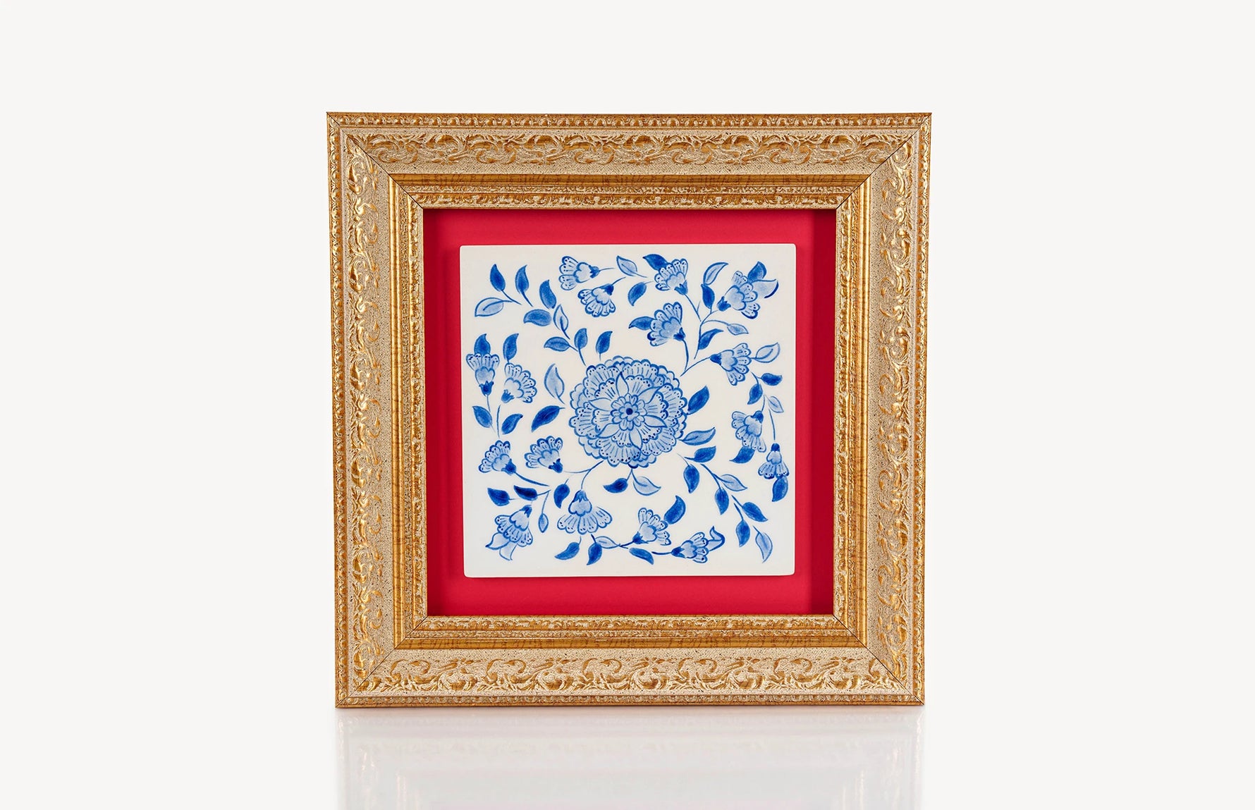 Blue and white wall decor ceramic square tile in a frame