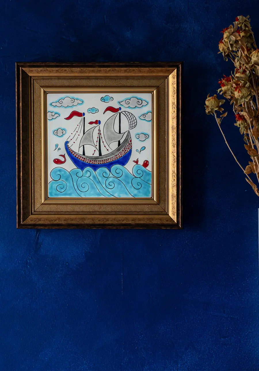 Turquoise and blue painted Turkish tile hanged on the wall