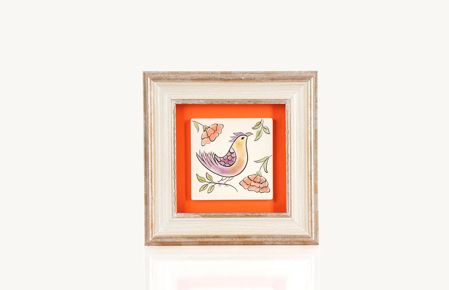 Painted bird motif on square ceramic tile with frame
